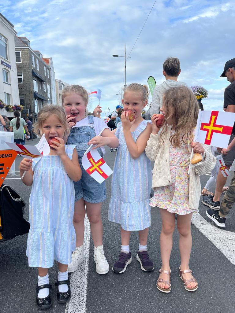 Children enjoying free fruit