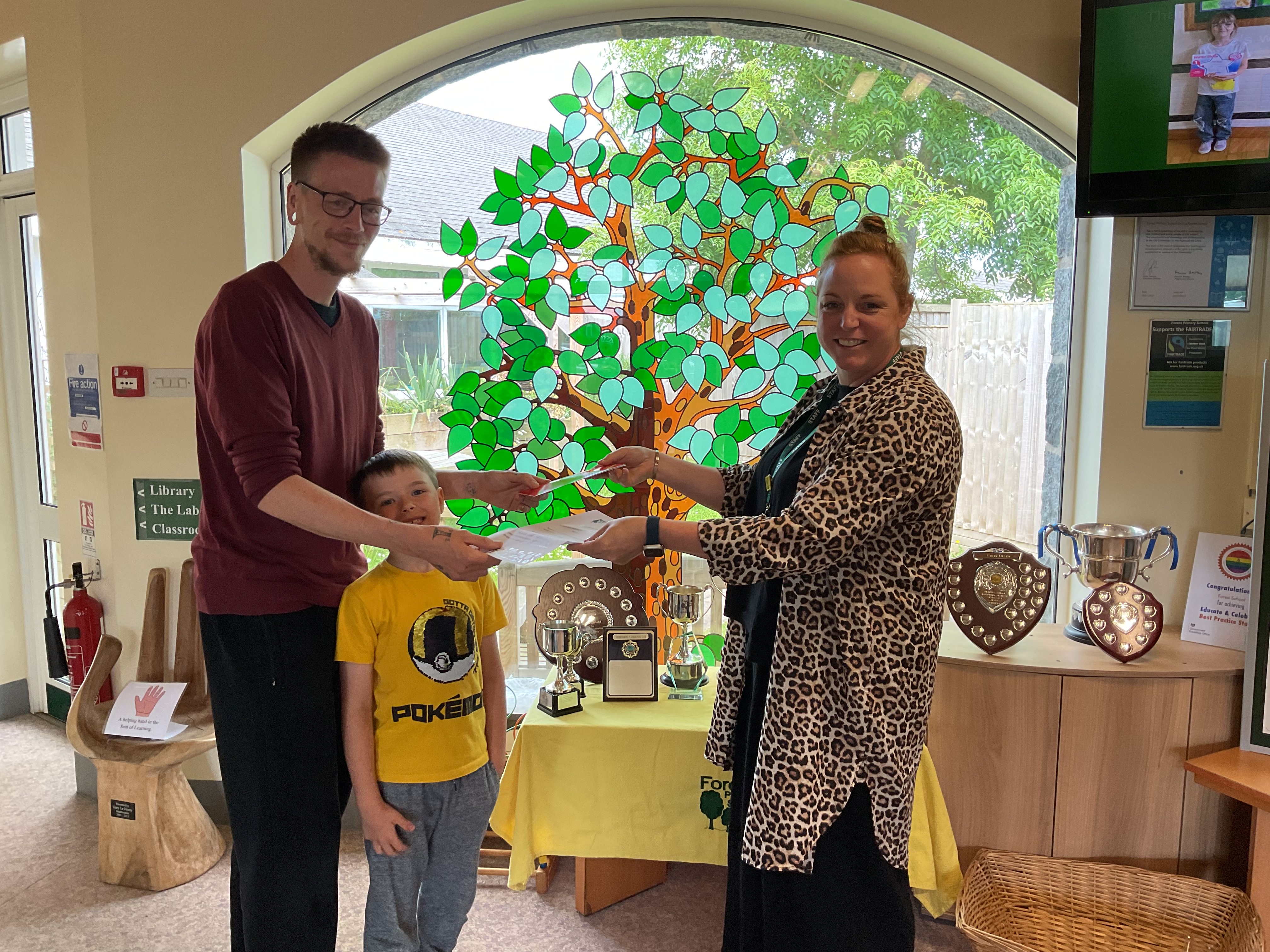 Deputy Headteacher, Emma King, awarding one of the prize winners with an Aladdin’s Cave voucher.